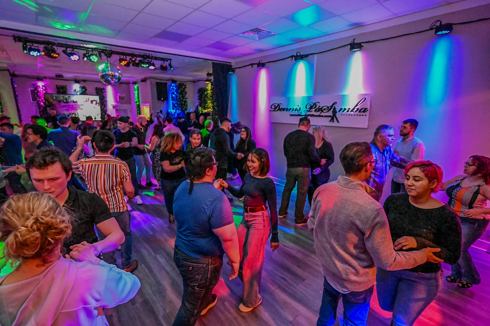 Couples dancing bachata at a Chicago Latin dance social