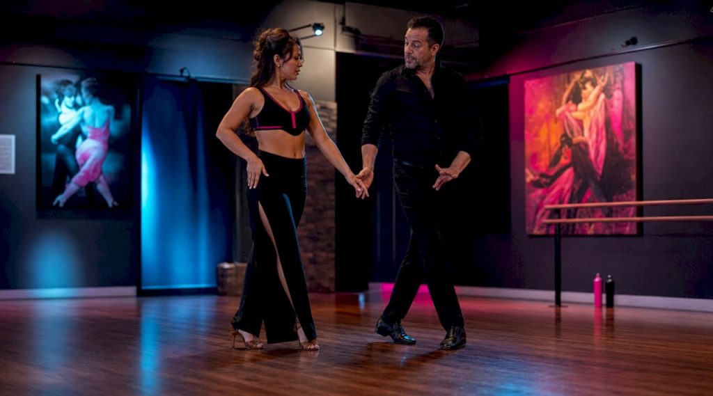 Adult woman receiving private dance instruction in studio