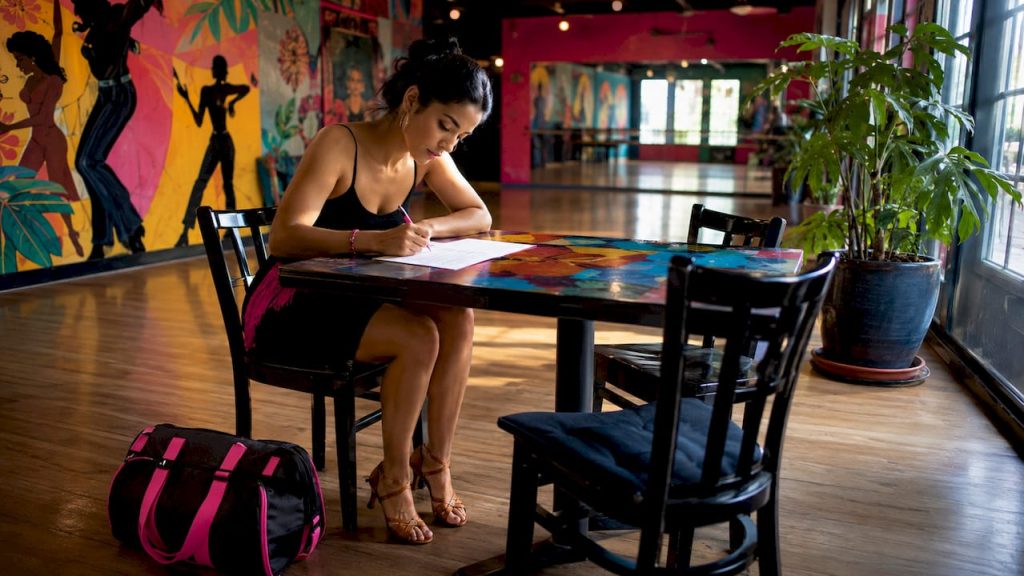 Beginner dancer reviewing dance studio questions list